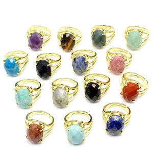 Detailed view of various natural stone oval faceted rings in gold adjustable bands