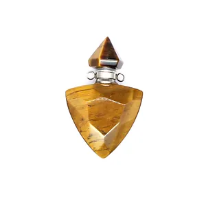 Close-up shot of a triangular faceted tiger eye stone aromatherapy oil bottle pendant