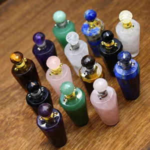 Macro view of assorted natural stone perfume bottle pendants with faceted crystal caps