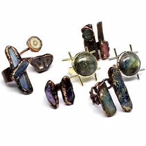Close-up view of vintage natural stone rings with labradorite and amethyst crystals