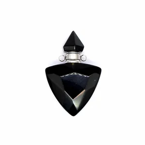Detailed macro view of a faceted black obsidian triangular perfume bottle pendant for oils
