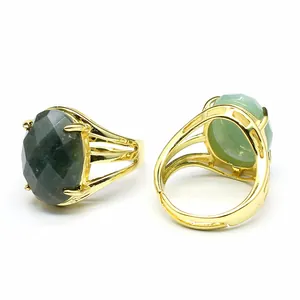 Detailed view of a vintage gold ring featuring a 13x18mm oval faceted natural gemstone