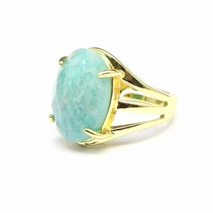 Macro view of a French vintage 13x18mm oval light blue stone ring with gold plated band