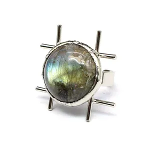 Detailed macro shot of a retro labradorite open ring with a unique silver cross setting.