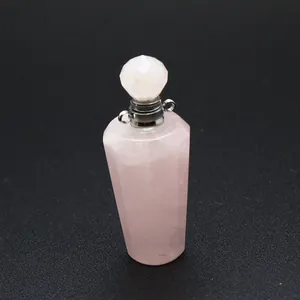 Macro detail view of pink natural rose quartz stone perfume bottle pendant jewelry