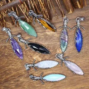 Detailed view of assorted natural crystal sword pendants with vintage silver frames.