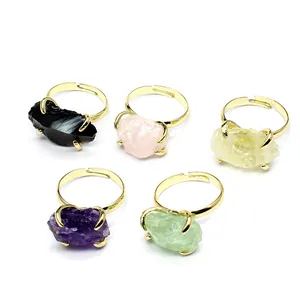 Set of five natural raw crystal stone rings with adjustable gold-toned claw settings