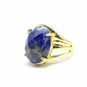 Close-up detail of 13x18mm oval faceted natural stone set in vintage gold ring band