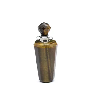 Close-up detail of a faceted natural tiger eye stone perfume bottle pendant diffuser