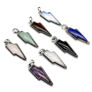 Detailed view of vintage lightning bolt pendants crafted from various natural crystal stones