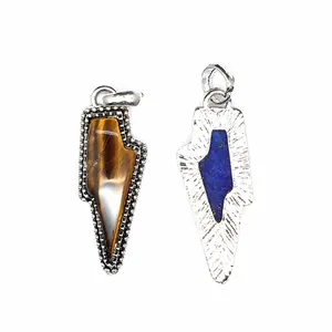 Detail view of retro natural tiger eye and lapis lazuli lightning bolt stone pendants