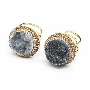 Detailed view of a handmade natural druzy agate ring featuring sparkling rhinestone halos