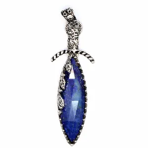 Close-up of a vintage style sword pendant with faceted deep blue lapis lazuli stone.