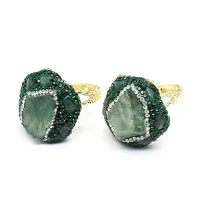Detailed view of handmade open adjustable ring with green natural stone and crystals