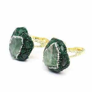 Close-up detail of handmade green natural stone adjustable ring with crystal inlay