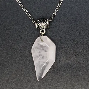 Close-up of faceted natural rose quartz pendant with decorative silver chain bead