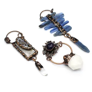 Detailed view of vintage raw crystal pendants featuring natural amethyst and quartz stones.