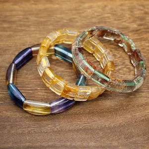 Close-up of natural stone crystal bracelets including green phantom and citrine