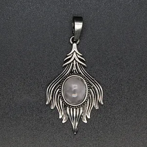 Close-up of a vintage silver-colored foxtail pendant with an oval translucent stone inlay