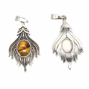 Detailed view of vintage natural stone pendants with intricate metal fox tail design