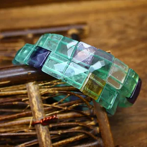 Detailed close-up of faceted natural colorful fluorite square beads in vintage style