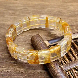 Macro detail of natural yellow phantom quartz crystal bracelet with rectangular beads