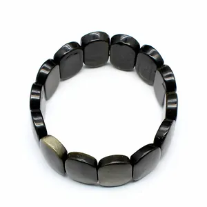 Detailed macro view of the polished 11x18mm natural black stone oval bead bracelet