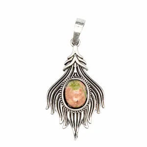 Vintage silver fox tail pendant with oval unakite stone detail macro view