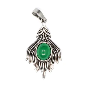 Detailed view of vintage silver fox tail pendant with oval green agate stone inlay.