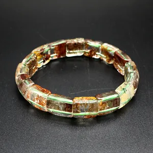 Macro view of natural phantom quartz crystal bracelet with unique inclusions