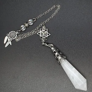 Detail of crystal pendulum pendant with star and dreamcatcher charms on silver chain.