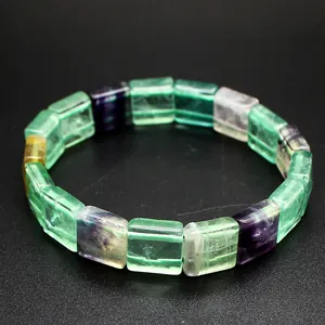 Macro view of square natural fluorite beads in green and purple jewelry shades.
