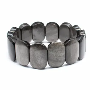 Detailed close-up showing the polished surface of dark oval natural stone bracelet