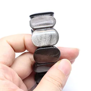 Close-up of natural stone oval smooth hand-row bracelet with metallic luster