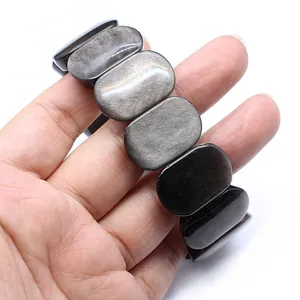Close-up of smooth 11x18mm elliptical natural stone beads on a stretch bracelet