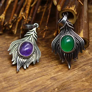 Detailed macro view of vintage natural stone pendants with amethyst and green agate