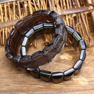 Close-up detail of natural Arizona tektite stone bracelet with textured finish