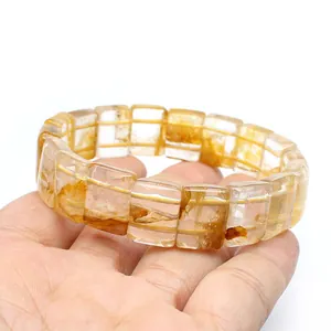 Close-up of natural yellow phantom quartz bracelet showing internal crystal texture