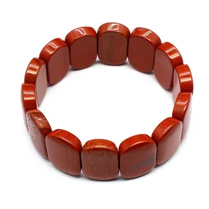 Handcrafted natural red stone bracelet featuring 11x18mm smooth oval shaped beads