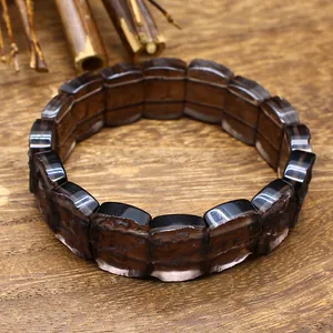 Macro view of translucent dark brown Arizona Sirius meteorite stone plate bracelet