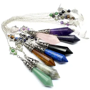 Detailed view of colorful hexagonal crystal prism pendulum pendants with silver star charms