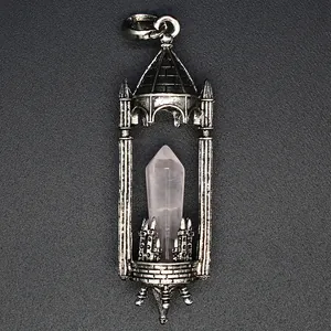Close-up of medieval castle style pendant with natural crystal hexagonal prism.