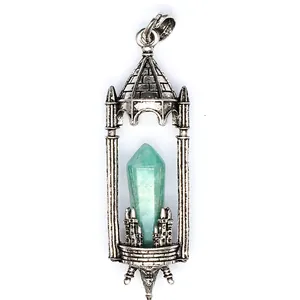 Detail of a vintage castle pendant with a natural Amazonite crystal point in silver.