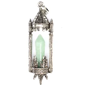 Close-up detail of vintage medieval castle pendant with light green hexagonal crystal stone.
