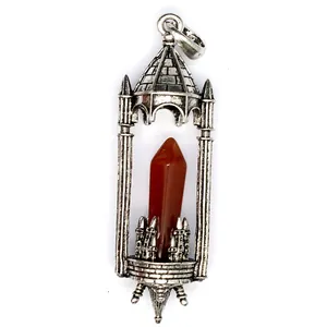 Detail view of retro medieval castle pendant with a natural red stone crystal column.