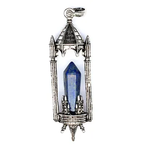 Macro view of a vintage gothic castle pendant featuring a blue lapis lazuli crystal pillar.