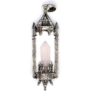 Vintage silver castle pendant detail featuring a natural rose quartz crystal point