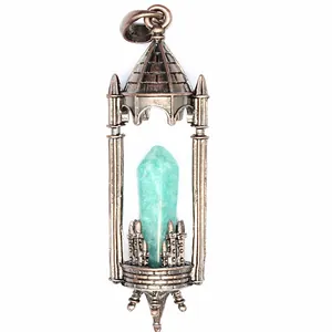 Vintage antique bronze castle pendant featuring a green hexagonal Amazonite crystal.