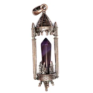 Detail showing the intricate medieval castle cage holding a purple amethyst hexagonal crystal.