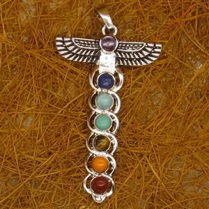 Detail of Egyptian style silver sword pendant with seven colorful chakra gemstones
